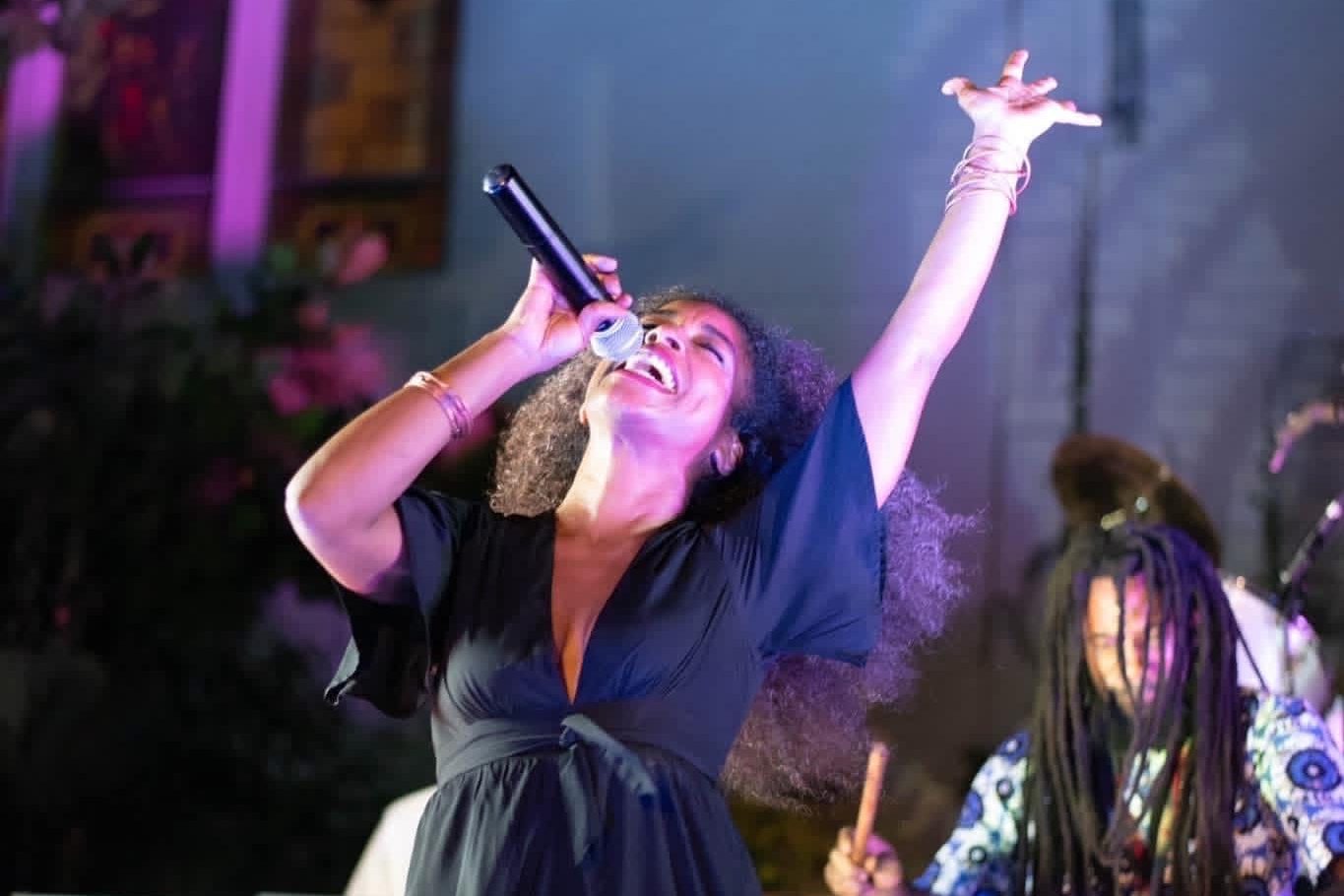 Melly Mel on stage with Baba Abasi Melissa MoonChild elated and singing with african drummer